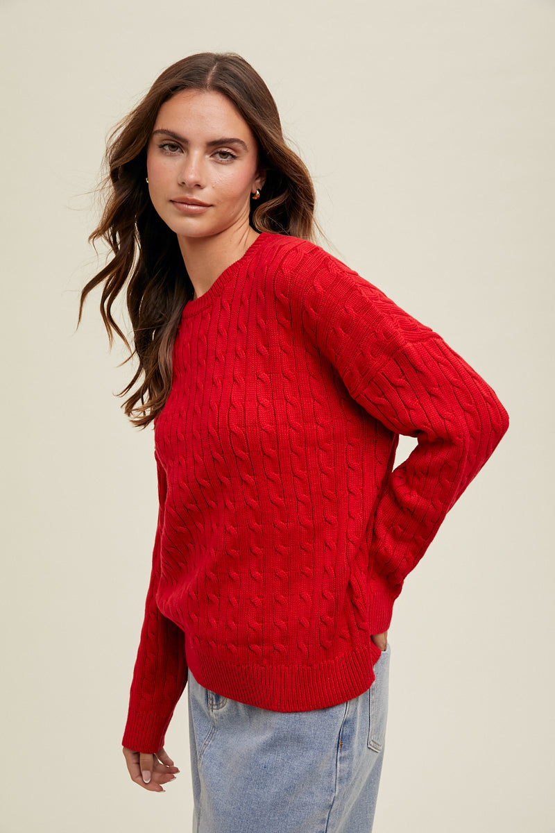 Cherry On Top Cable Knit Sweater: a classic piece designed with a round neckline, drop shoulder and ribbing at the cuffs and hemline. True red casual sweater with cable detail.