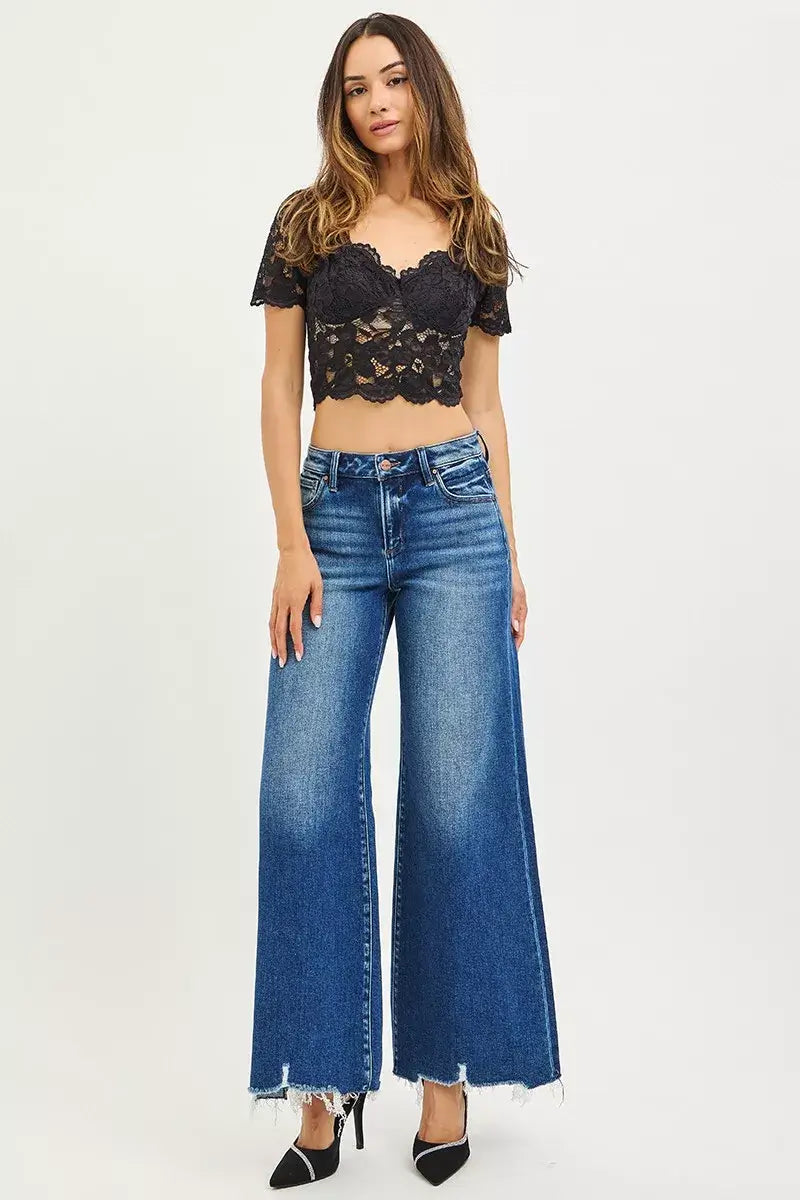 Risen High Rise Wide Leg Jeans with Distressed Hem