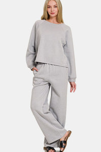 Grey Fleece Raglan Sleeve Pullover & Sweatpants Lounge Set. Two-piece fleece lined including a relaxed fit pullover top and straight cut pants with pockets. 