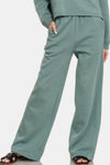 Ash Jade Fleece Raglan Sleeve Pullover & Sweatpants Lounge Set. Two-piece fleece lined including a relaxed fit pullover top and straight cut pants with pockets. 