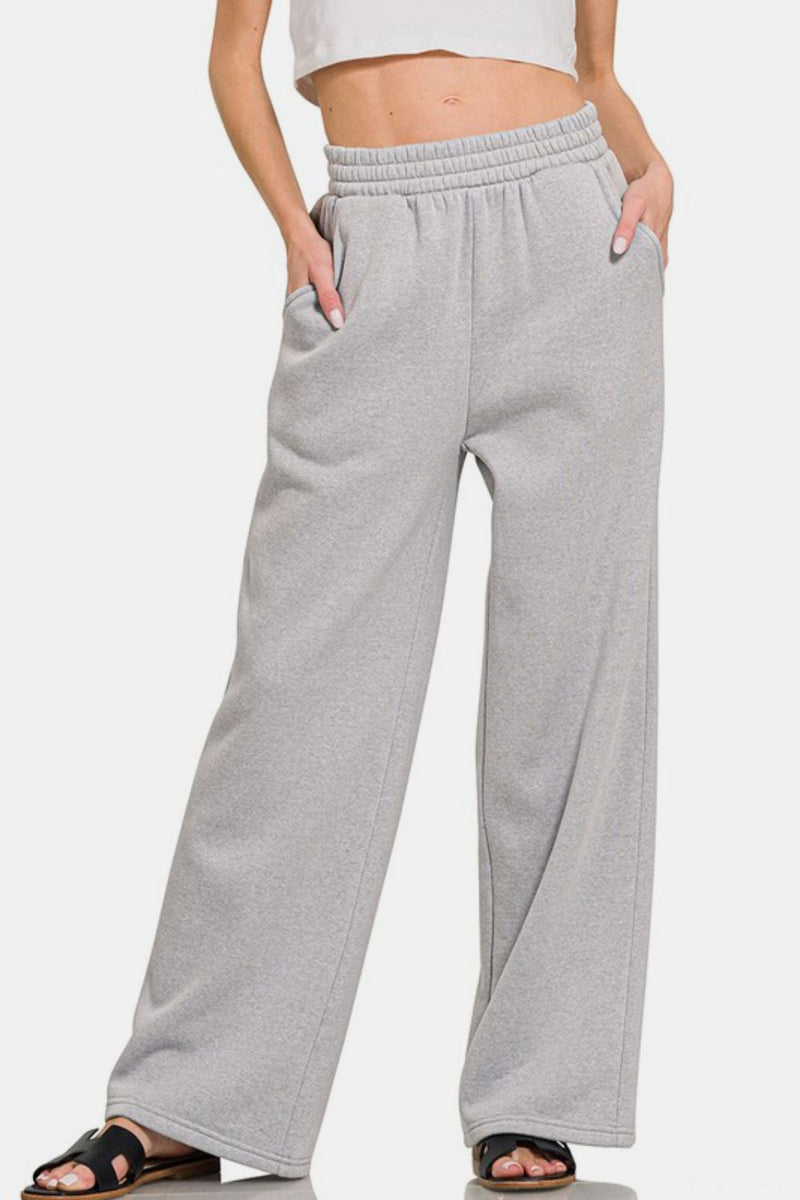 Grey Fleece Raglan Sleeve Pullover & Sweatpants Lounge Set. Two-piece fleece lined including a relaxed fit pullover top and straight cut pants with pockets. 