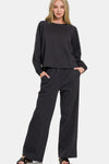 Black Fleece Raglan Sleeve Pullover & Sweatpants Lounge Set - The sweatshirt is designed with a round neckline, raglan style sleeves, and cuffs. Paired with matching black pants that feature an elastic waist, relaxed straight cut, and convenient pockets.