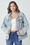 RISEN Relaxed Fit Distressed Drawstring Hooded Denim Jacket. Light acid wash denim jacket with removeable hood, a button down front, button cuffs, front button pockets, additional side pockets, and a relaxed fit.