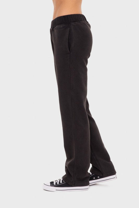 Black Mono B Elastic Waist Fleece Pants with Pockets. Black fleece sweatpants with an elastic waistband and pockets. 