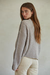 Been Awhile Contrast Stitch Pullover Sweater. This heather stone colored knit sweater features a round ribbed neckline, drop shoulder, contrast stitching, and a boxy relaxed fit through the body.