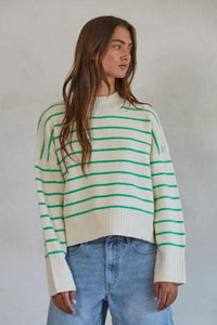 Geneva Green Striped Sweater
Featuring a mock turtleneck, drop shoulder, ribbed neckline, cuffs, and hemline, and a boxy fit. 
This cheery striped sweater will brighten up grey winter skies! 