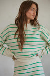 By Together Geneva Green Striped Sweater Featuring a mock turtleneck, drop shoulder, ribbed neckline, cuffs, and hemline, and a boxy fit. 
This cheery striped sweater will brighten up grey winter skies! 