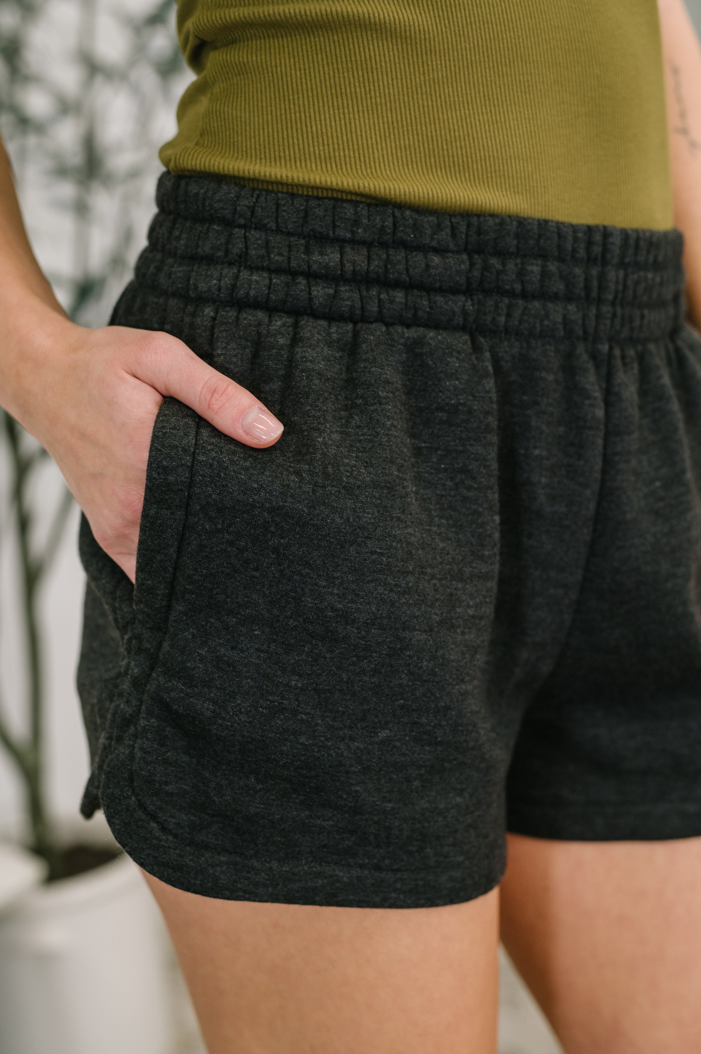 Zenana Acid Wash Elastic Waistband Dolphin Hem Shorts in Black