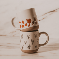 Sweet Water Decor Orange Leaves 14 oz Cream Stoneware Coffee Mug
