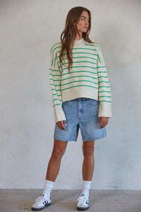 By Together Geneva Green Striped Sweater Featuring a mock turtleneck, drop shoulder, ribbed neckline, cuffs, and hemline, and a boxy fit. 
This cheery striped sweater will brighten up grey winter skies! 