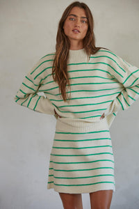 By Together Geneva Green Striped Sweater Featuring a mock turtleneck, drop shoulder, ribbed neckline, cuffs, and hemline, and a boxy fit. 
This cheery striped sweater will brighten up grey winter skies! 