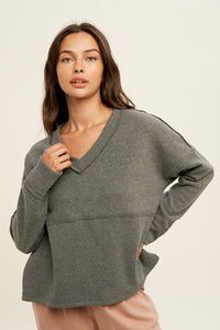 Wishlist brand casual top in grey designed with a v-neckline, drop shoulder, contrast fabric detail and a relaxed fit. The perfect everyday casual lounge top. 