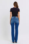 Judy Blue Mid-Rise Thermal Bootcut Jeans. These bootcut jeans feature Judy Blue stretch denim with a mid rise, medium wash, stitching on the back pockets, and no distressing.