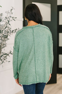 Zenana Heathered Exposed Seam Hi-Low Long Sleeve Top in Dark Green