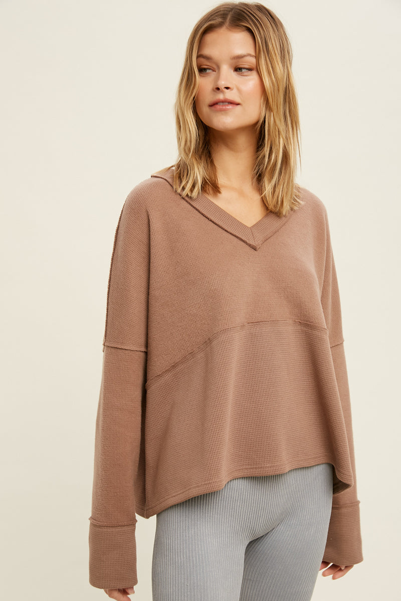 Wishlist brand casual top in mocha designed with a v-neckline, drop shoulder, contrast fabric detail and a relaxed fit. The perfect everyday casual lounge top. 