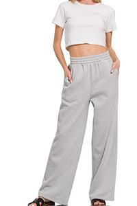 Grey Fleece Raglan Sleeve Pullover & Sweatpants Lounge Set. Two-piece fleece lined including a relaxed fit pullover top and straight cut pants with pockets. 