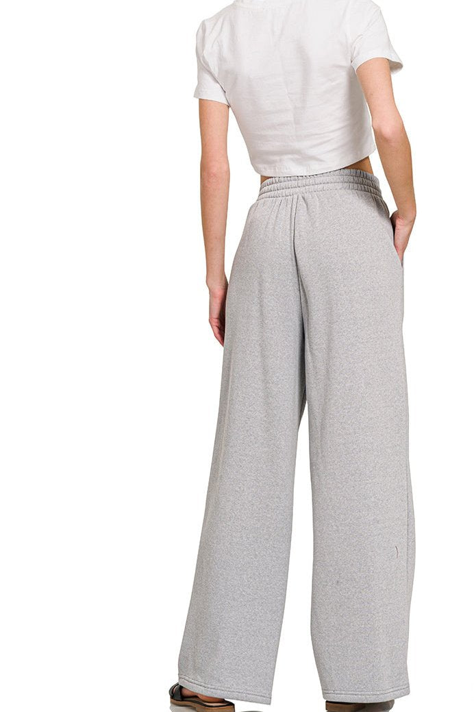 Grey Fleece Raglan Sleeve Pullover & Sweatpants Lounge Set. Two-piece fleece lined including a relaxed fit pullover top and straight cut pants with pockets. 