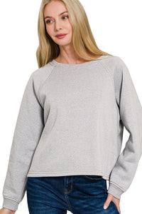 Grey Fleece Raglan Sleeve Pullover & Sweatpants Lounge Set. Two-piece fleece lined including a relaxed fit pullover top and straight cut pants with pockets. 