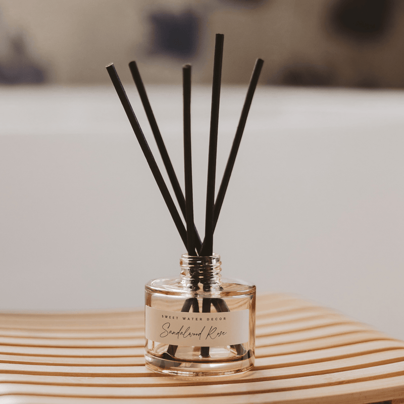 Sweet Water Decor Sandalwood Rose Tinted Glass Jar Reed Diffuser
