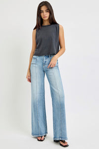 Risen Mid Rise Front Seam Patch Pocket Wide Leg Jeans. These medium wash jeans are designed with a mid-rise, wide leg silhouette, front seam detail, and front patch pocket design. Style# RDP5851