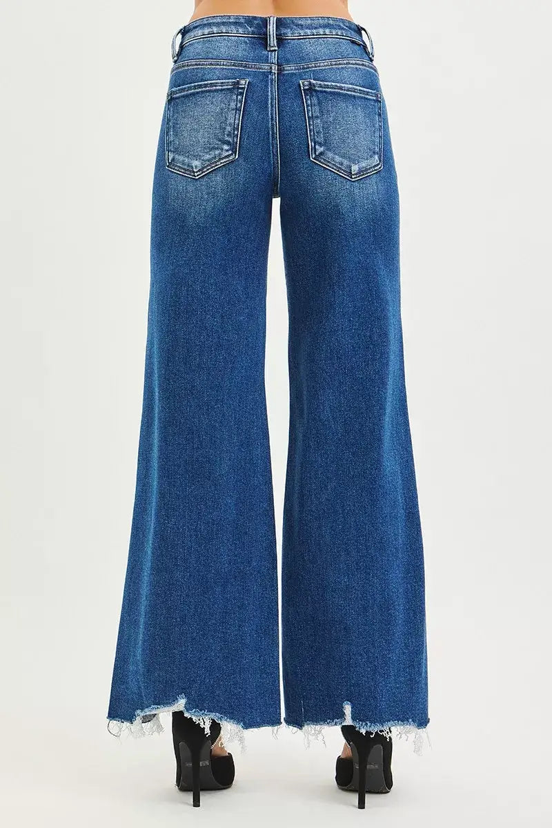 Risen High Rise Wide Leg Jeans with Distressed Hem