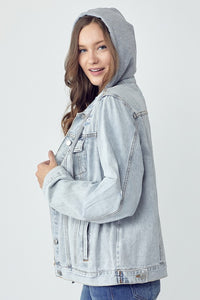 RISEN Relaxed Fit Distressed Drawstring Hooded Denim Jacket. Light acid wash denim jacket with removeable hood, a button down front, button cuffs, front button pockets, additional side pockets, and a relaxed fit.