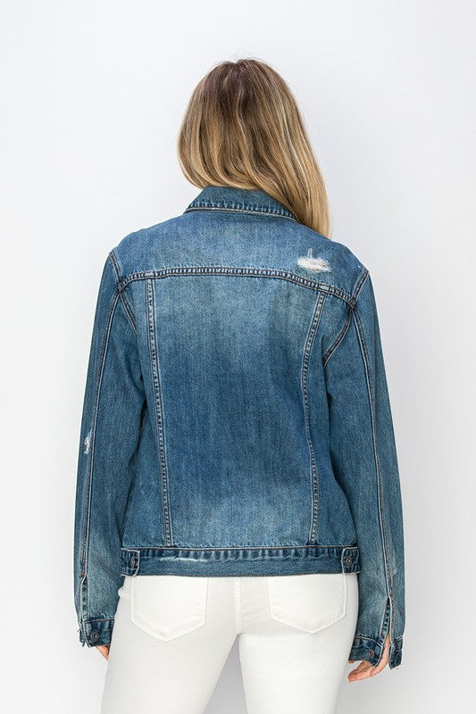 RISEN Relaxed Fit Vintage Wash Denim Jacket. Vintage wash denim jacket with a button down front, button cuffs, front button pockets, additional side pockets, and a relaxed fit. 