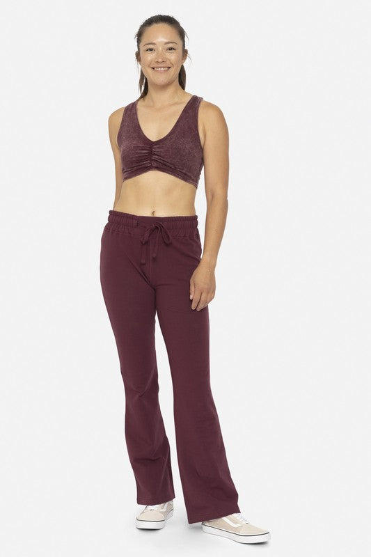 Plum Mono B Drawstring Flared Cotton Leggings. Designed with soft cotton fabric with a fold over waistband. These leggings can be worn high-waisted or low-waisted, giving you the flexibility to choose your preferred fit.