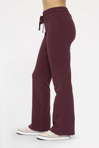 Plum Mono B Drawstring Flared Cotton Leggings. Designed with soft cotton fabric with a fold over waistband. These leggings can be worn high-waisted or low-waisted, giving you the flexibility to choose your preferred fit.