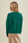 Merry Sweater: This sweater features fuzzy Merry lettering on a cheerful green knit background, with a round neckline, and drop shoulder.